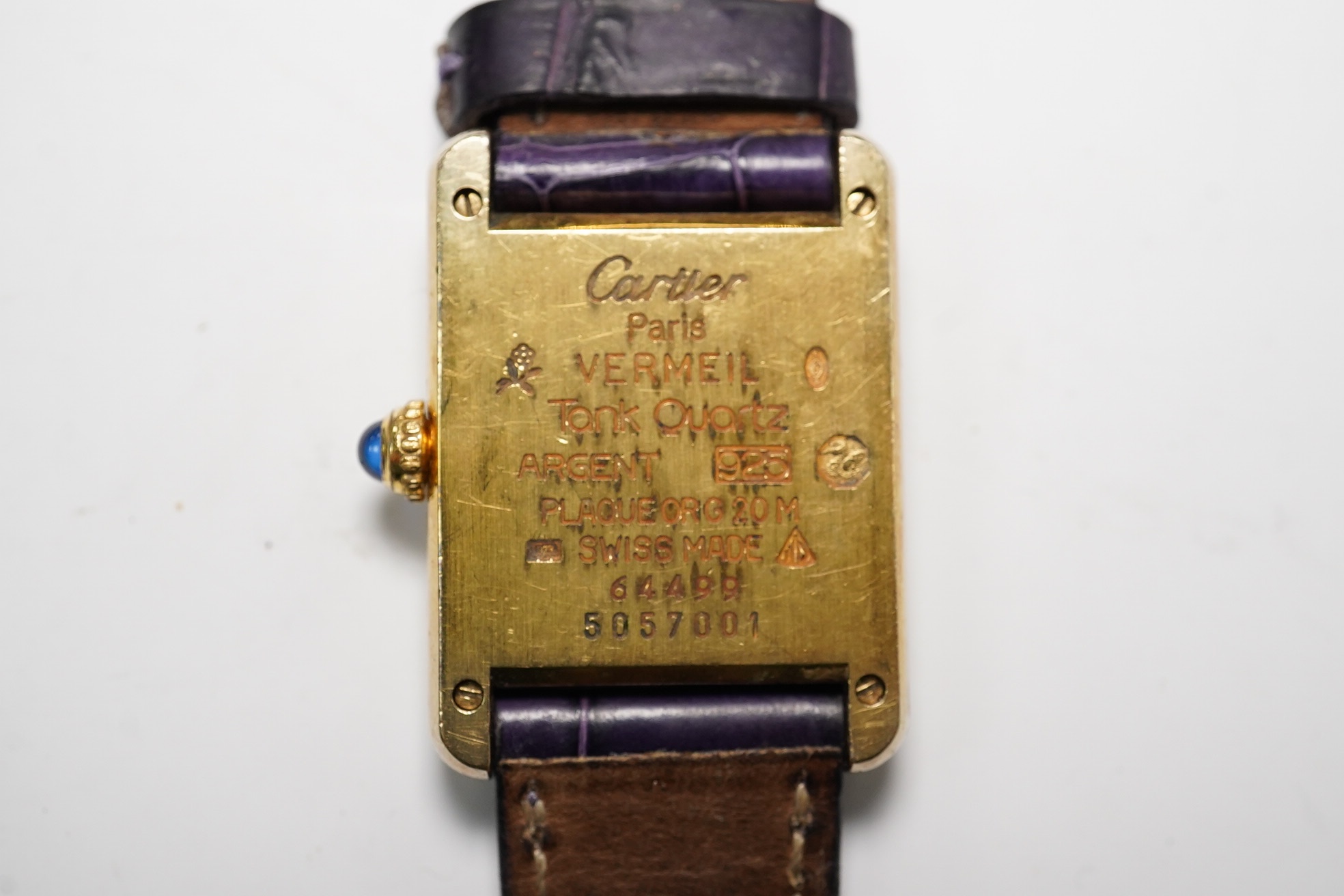A lady's Cartier Vermeil Tank gilt 925 quartz wrist watch, with cabochon sapphire set crown and Cartier leather strap, cased diameter 20mm, no box or papers. Condition - poor to fair